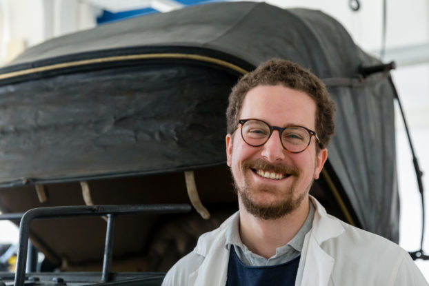 Matthias Manzini in the workshop in front of his restoration project